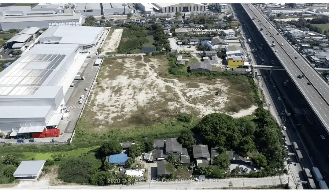 Aerial view of vacant land for build to suit Bangna KM.19, near highway and industrial buildings.