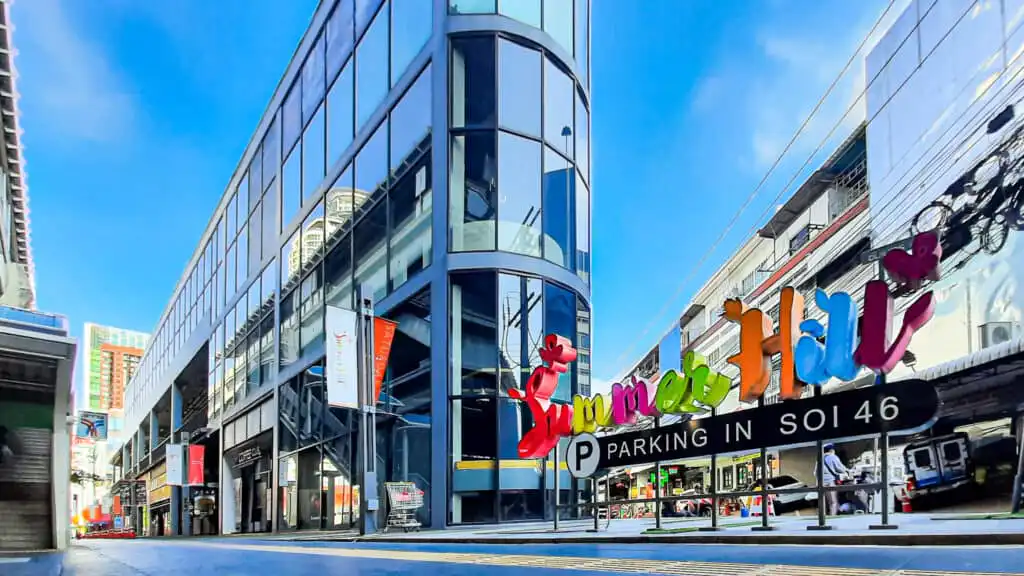 Summer Hill Sukhumvit building with "Parking in Soi 46" sign. Modern architecture in Bangkok.