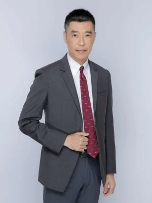 Board of Director in suit and tie looking at the camera.